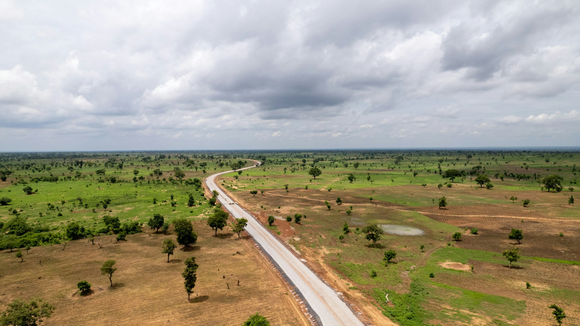 New road through open savanna land outside Abuja